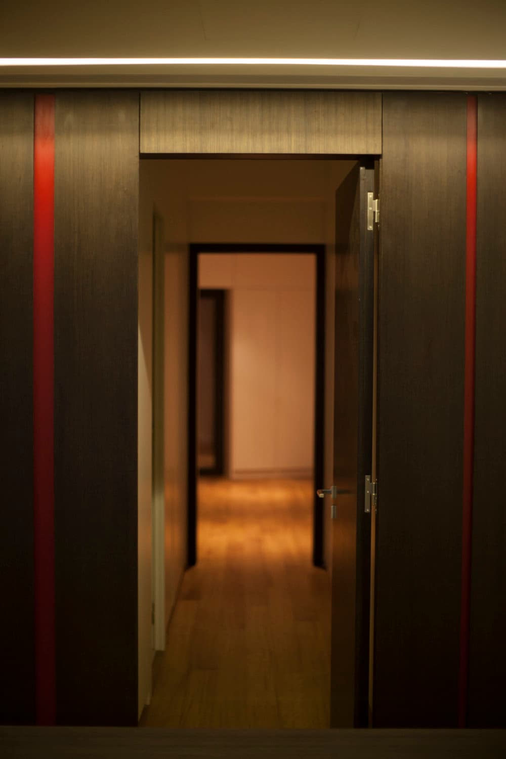 Hidden door opening to the private corridor
