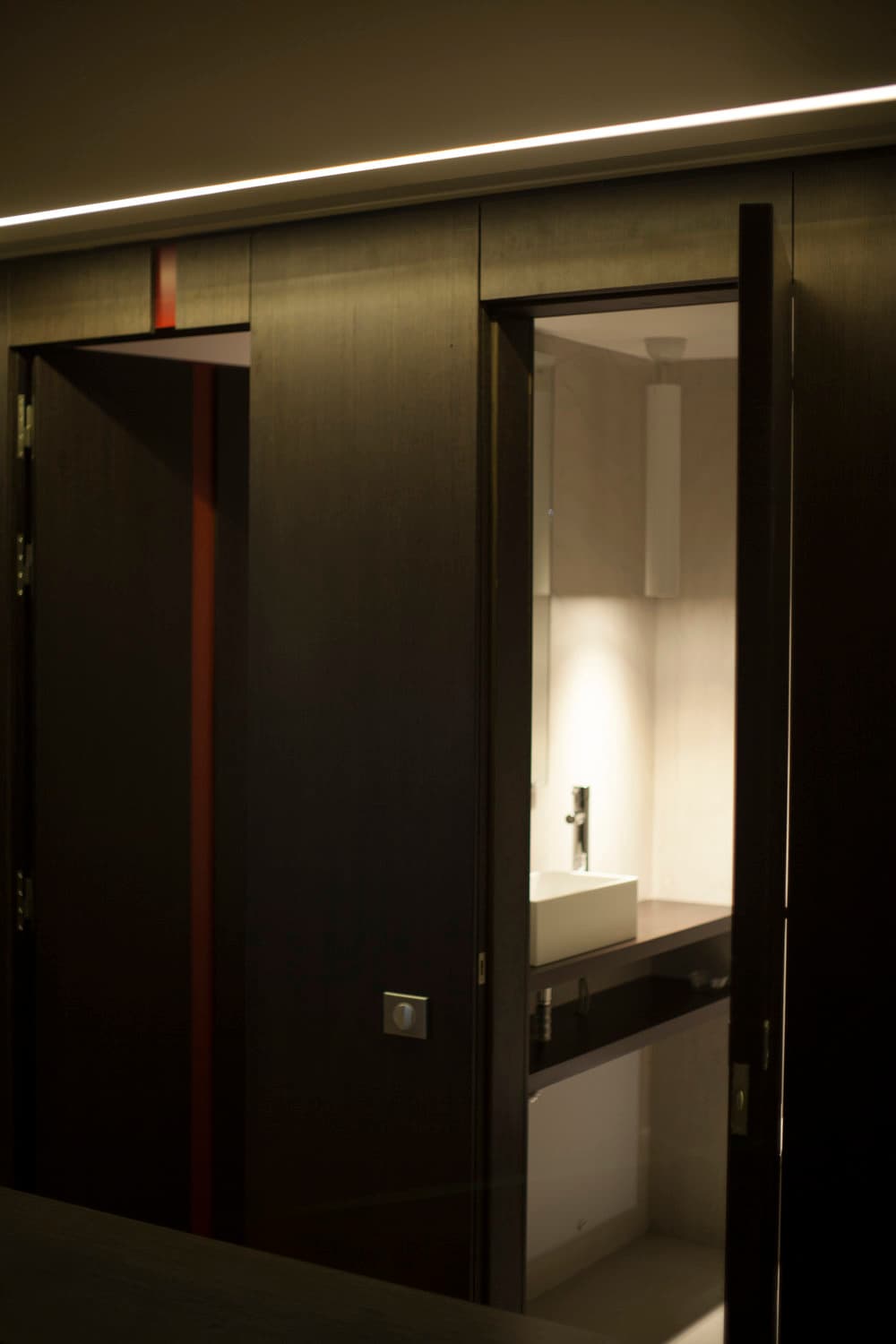 Concealed doors revealing the bathroom