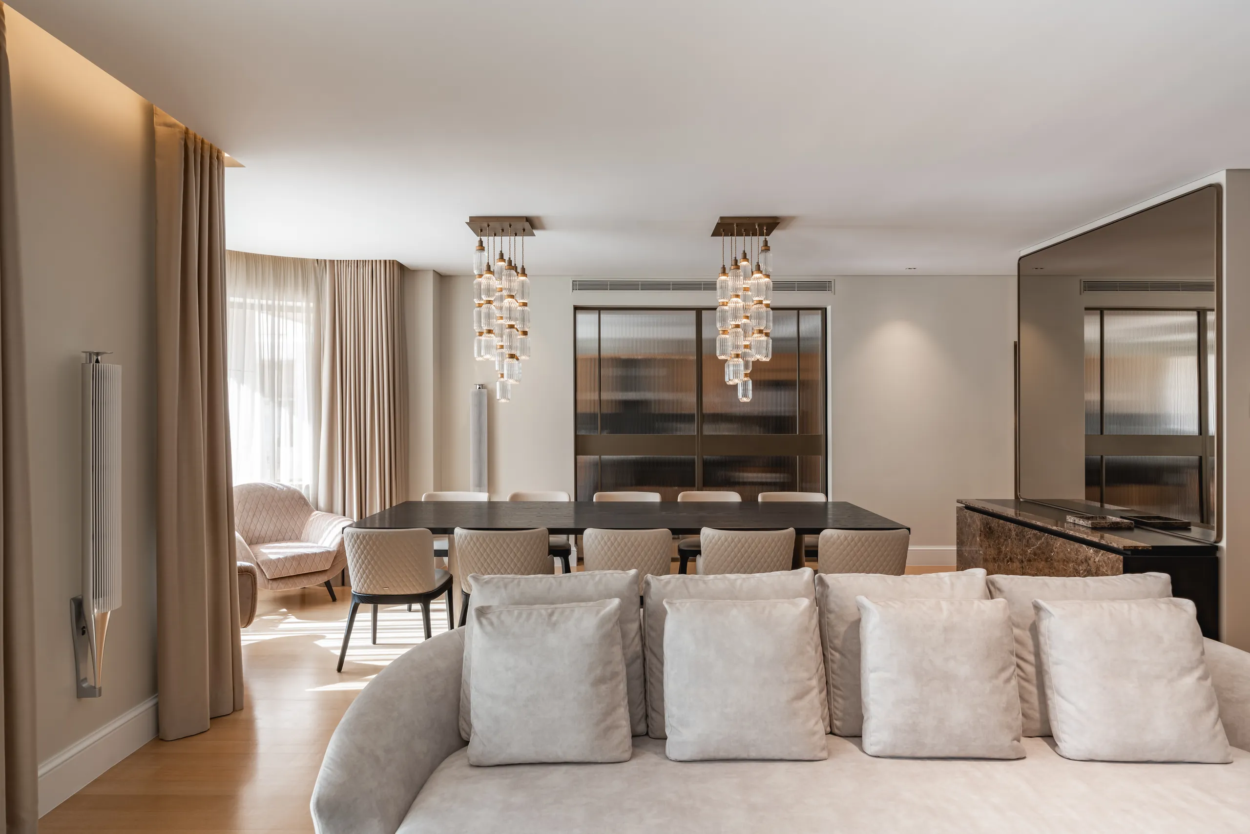 Dining room with the curved sofa lounge beyond