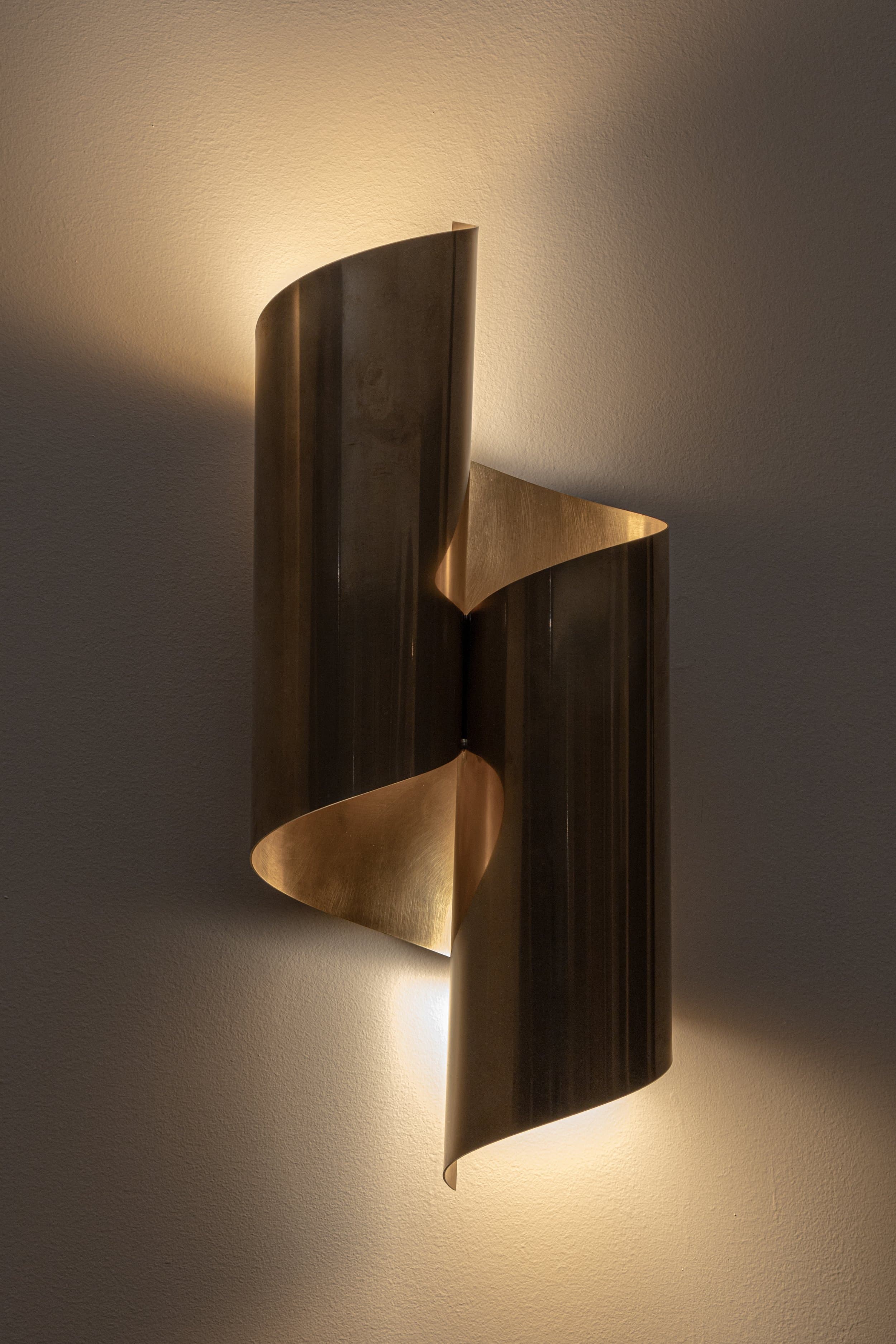 Sculptural brass wall light