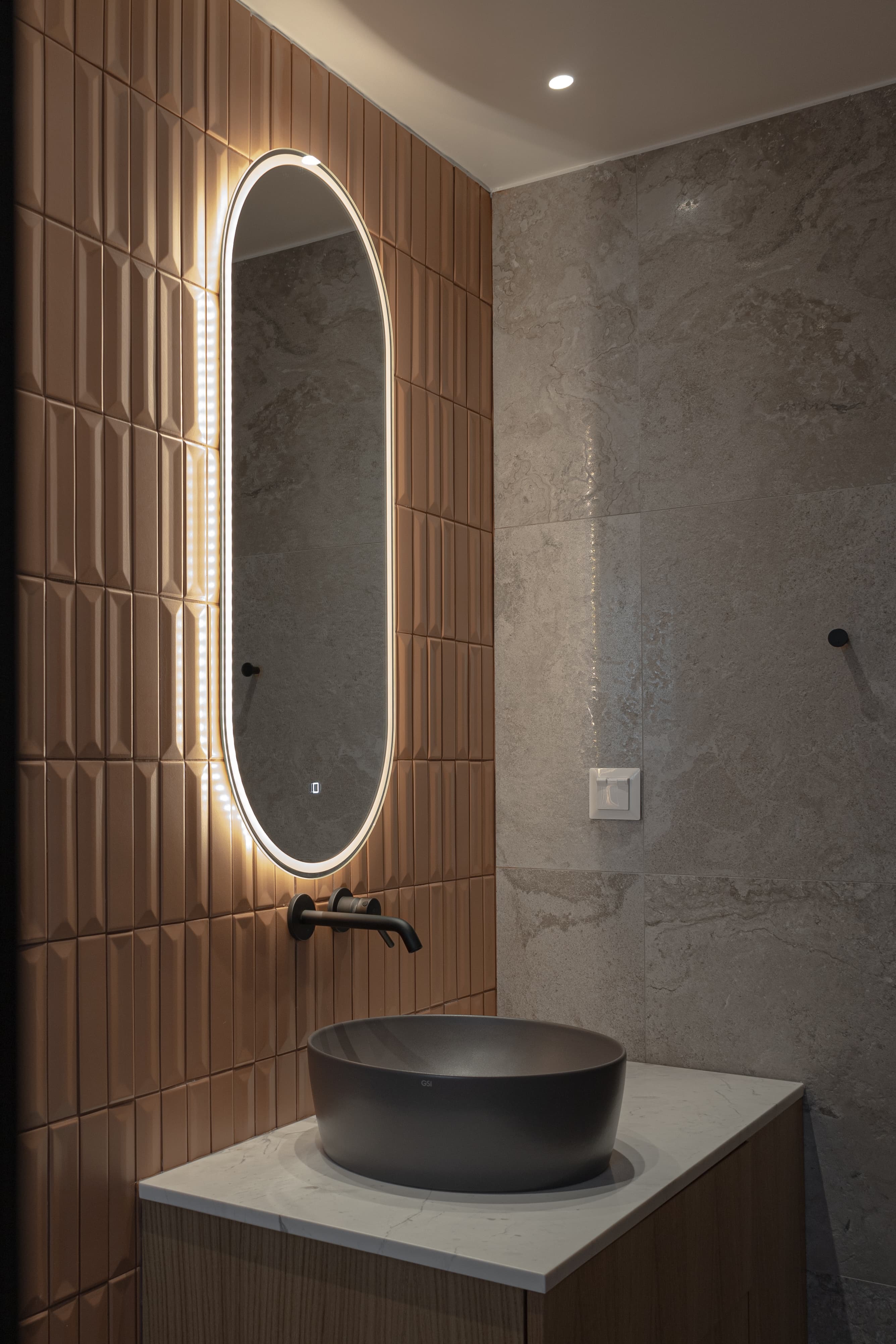 Vanity corner in terracotta tile and stone