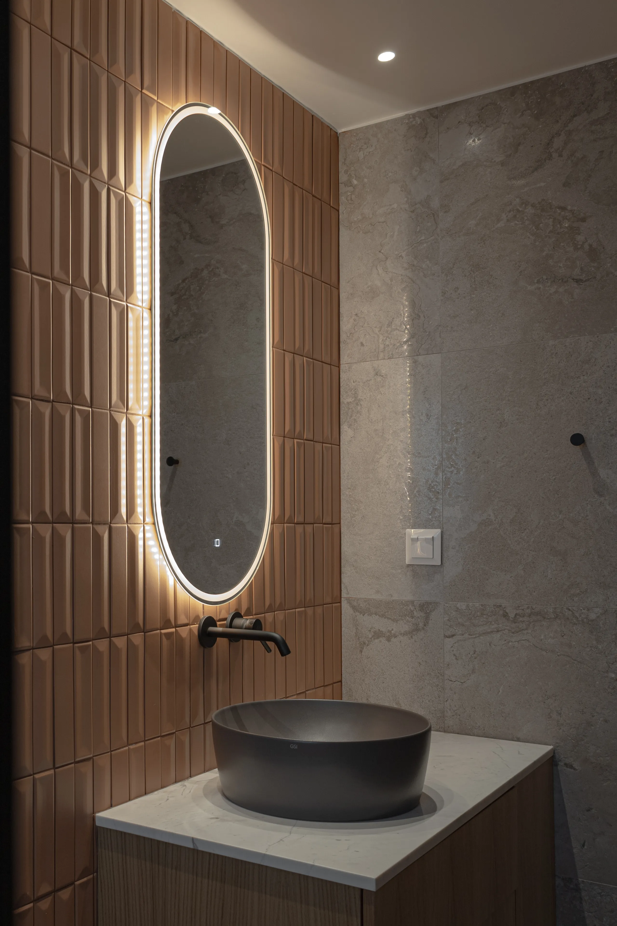 Vanity corner in terracotta tile and stone