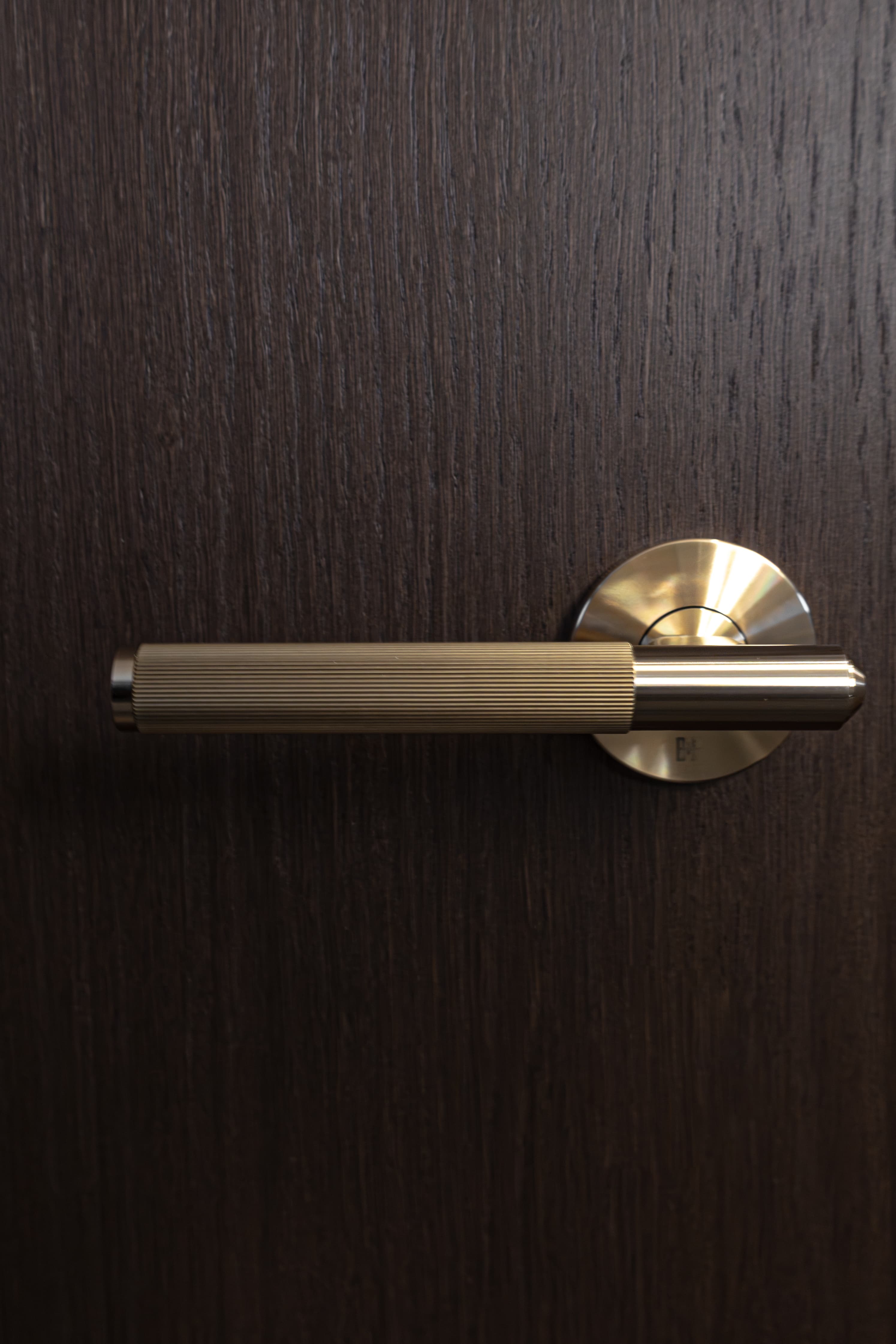 Knurled brass door lever