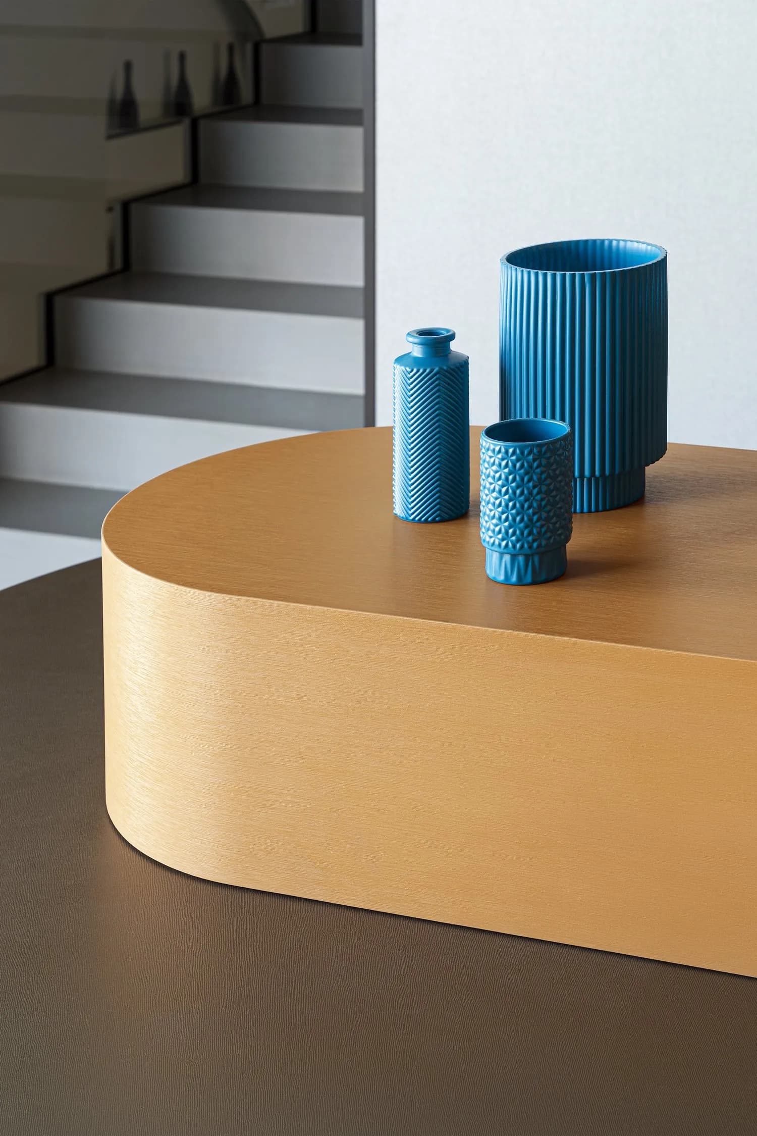 Blue vases on the brushed gold counter of the Disco Bar