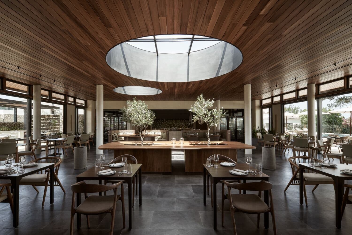 Restaurant dining room beneath circular skylights