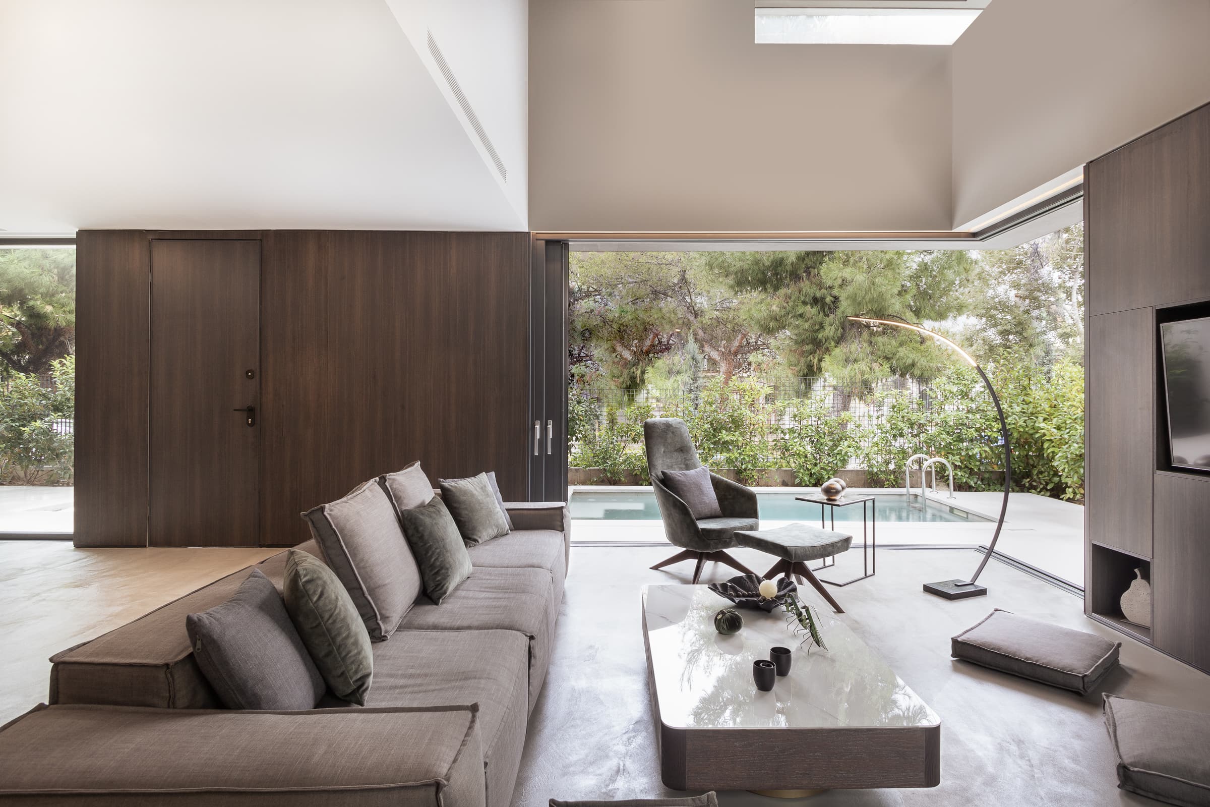 Living room opening to the pool and courtyard